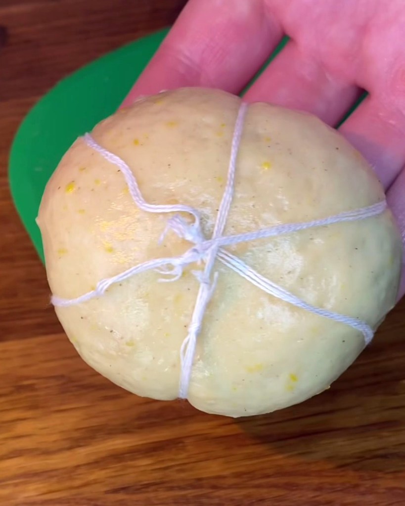 Dough ball tied with cotton string